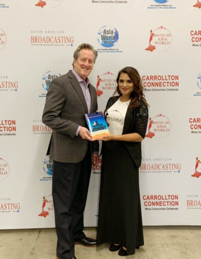 Presenting-Book-to-Frank-Starkey-VP-Training-at-Dale-Carnegie